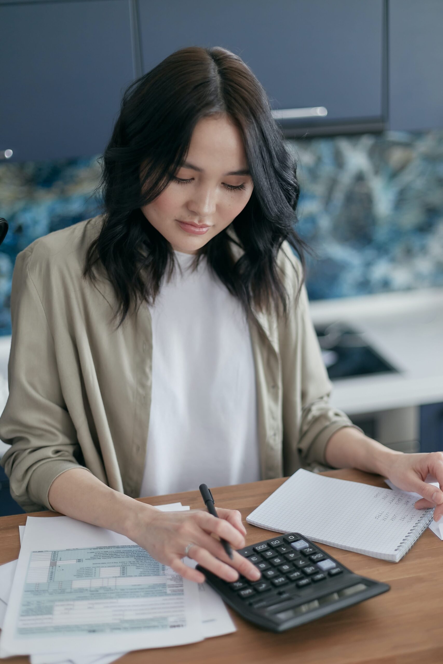 Woman calculating money needed for down payment