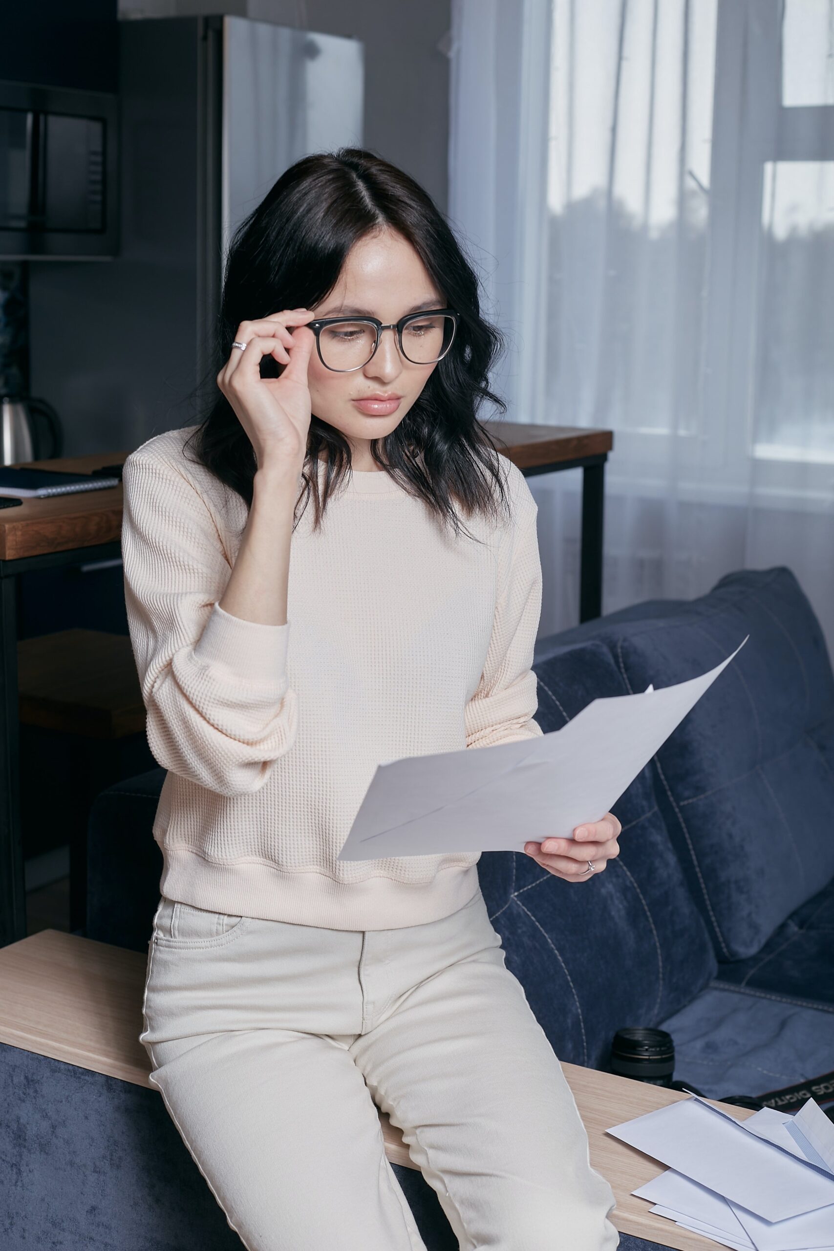 Woman examining monthly debt statement