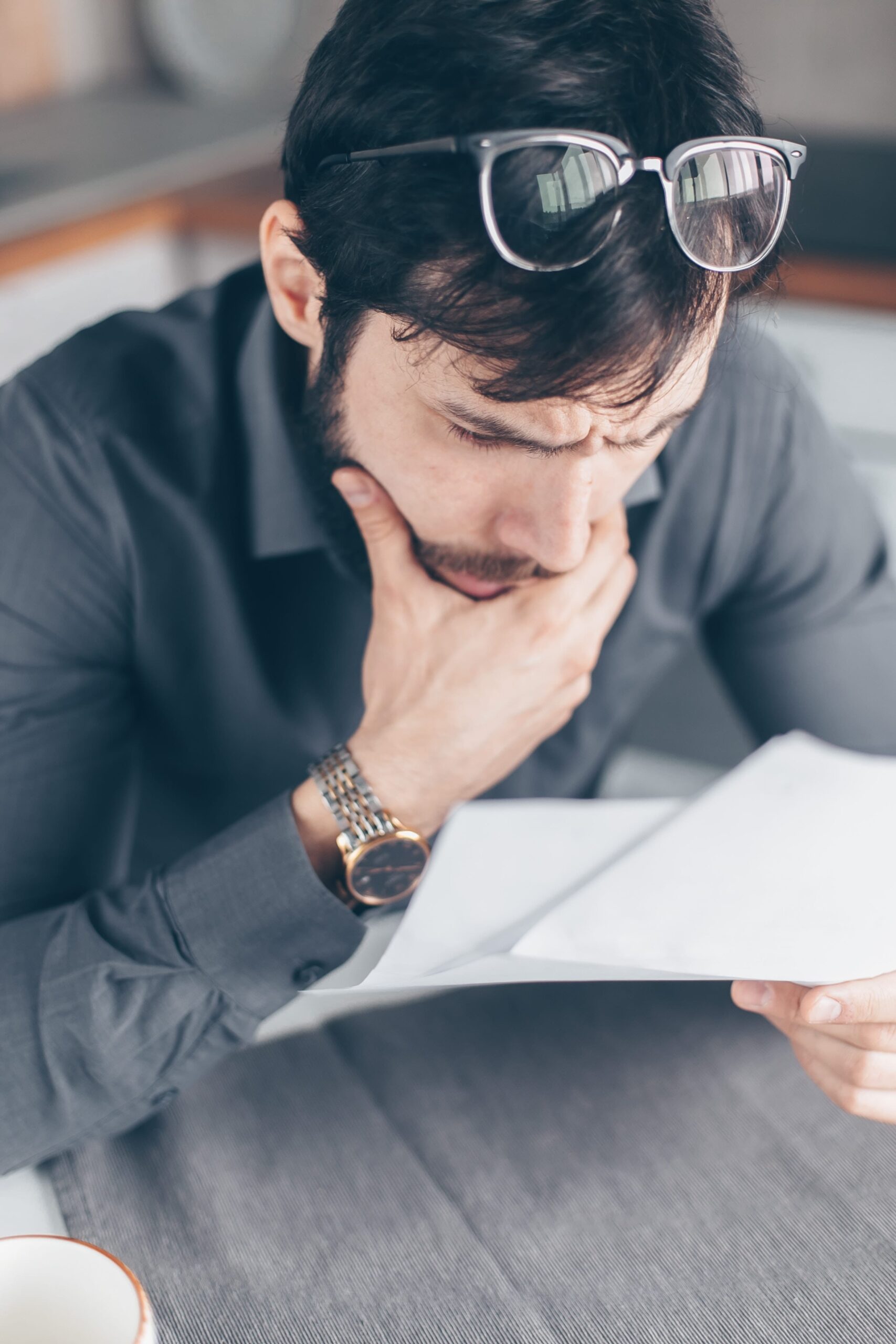 Man looking at a debt statement from using credit cards