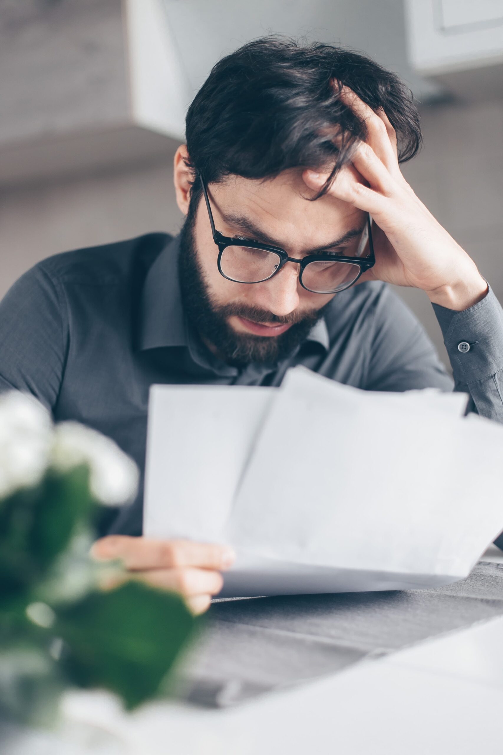 Man experiencing anxiety from impending bankruptcy